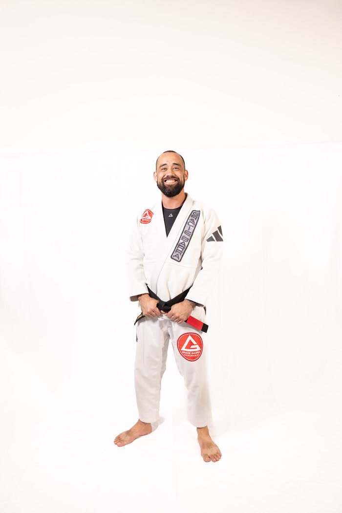 Professor Chris Belsky in a blue gi with a black belt