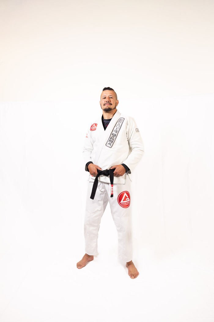 Professor Sardinha in a white gi with a black belt